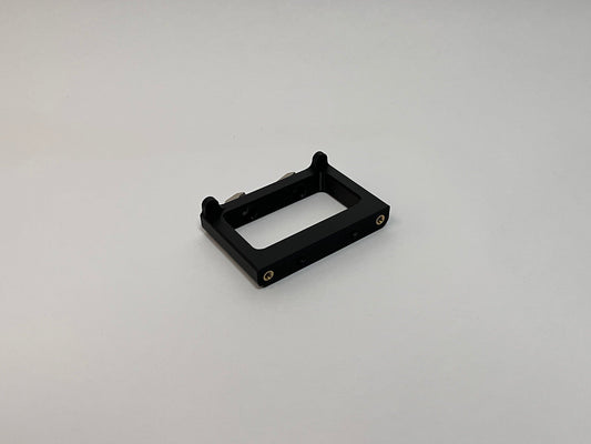 front side view of the button box solid mount showing 4040 profile mounting hardware installed on the mount on a white background