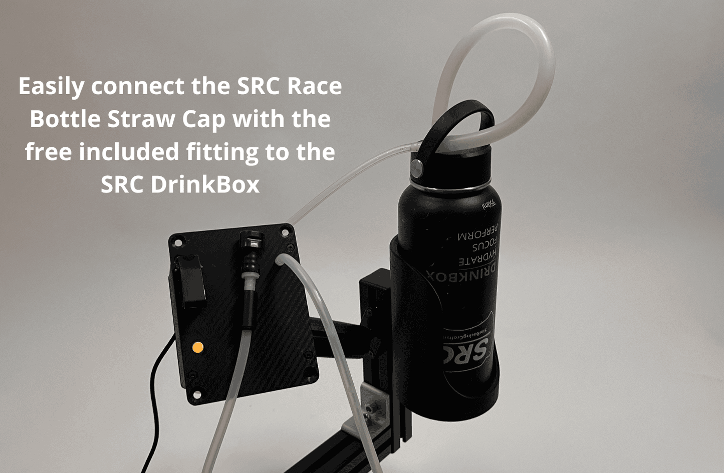 A black bottle with an attached clear straw hose and black mounting bracket, shown against a light gray background with overlaid text explaining connection to an SRC DrinkBox.