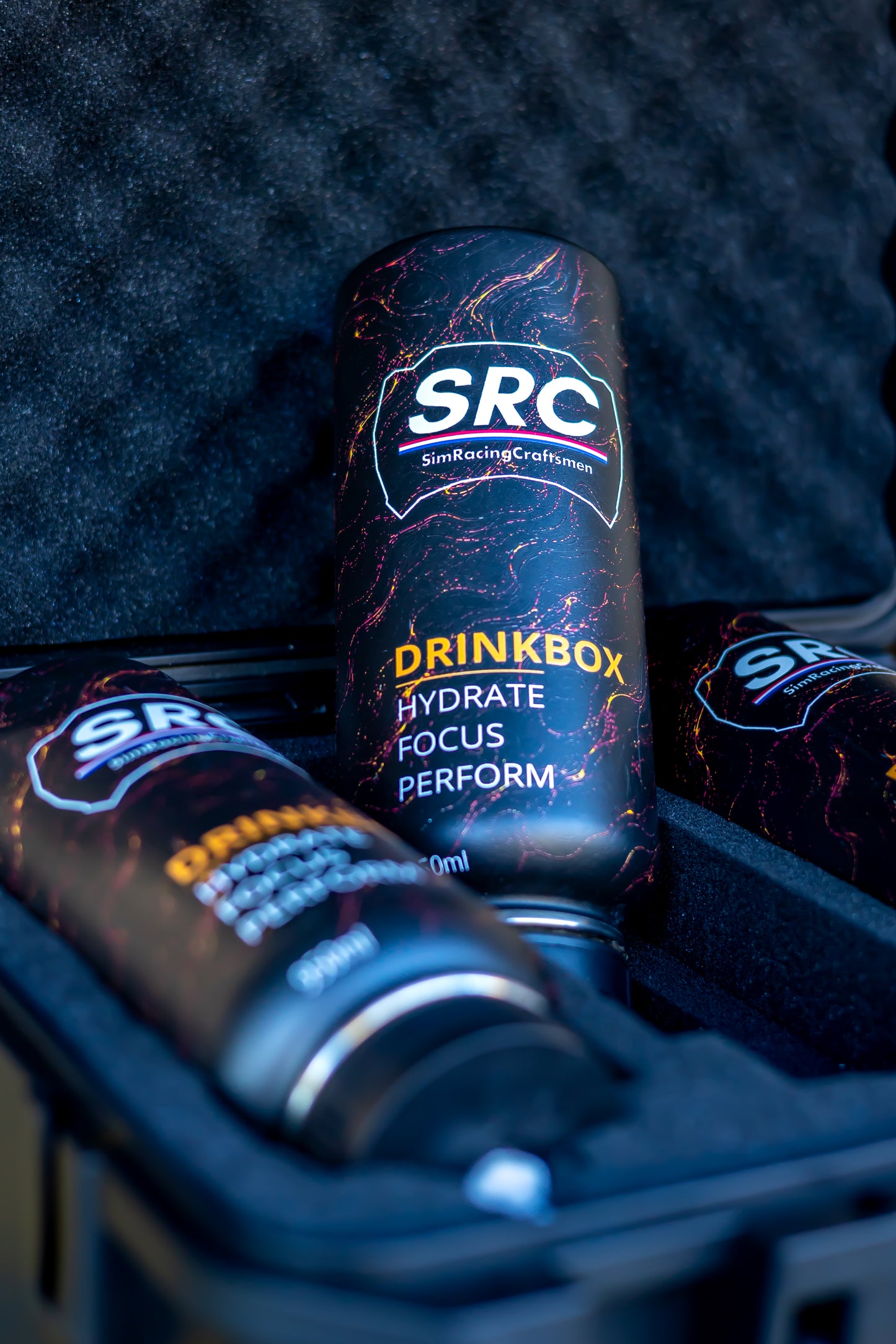 3 SRC racing hydration bottles in a travel case laid in foam with one propped up