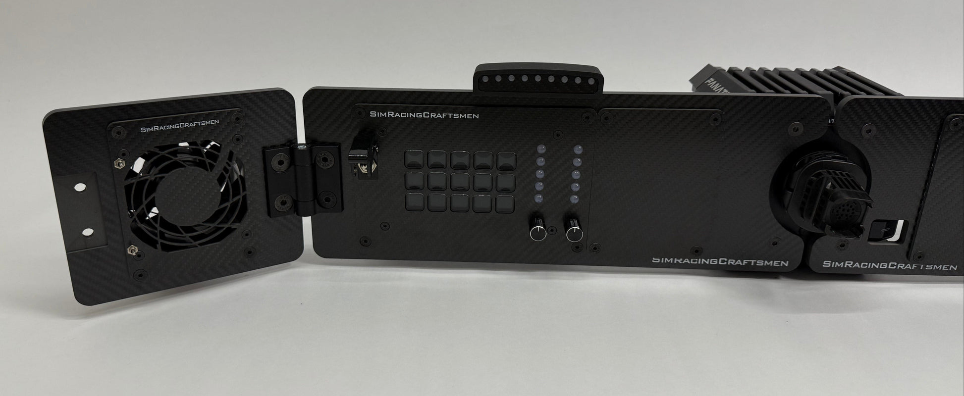 left side of sim racing setup with wind simulator and sim brows installed