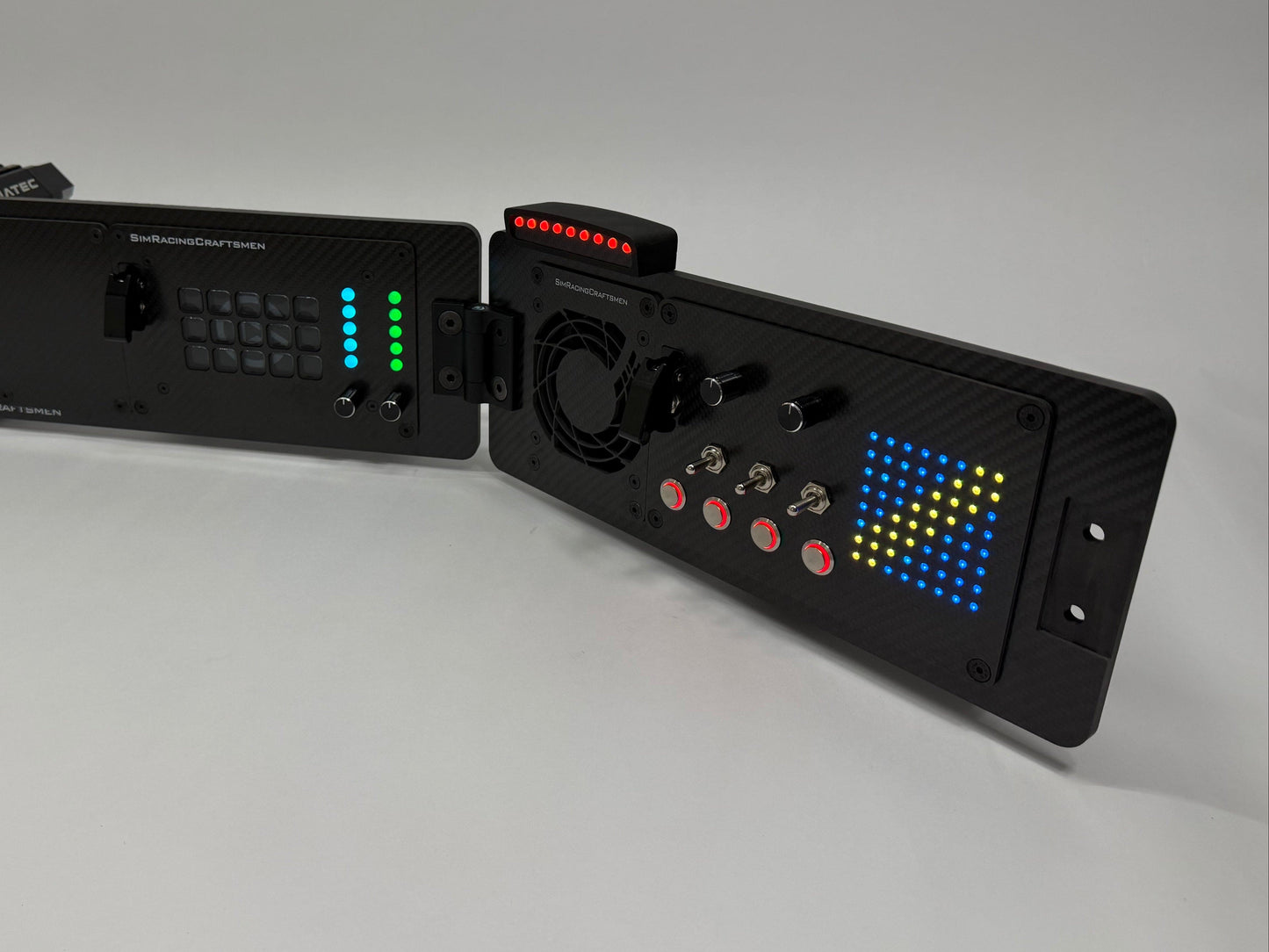 Black Button Box with digital display on a white surface