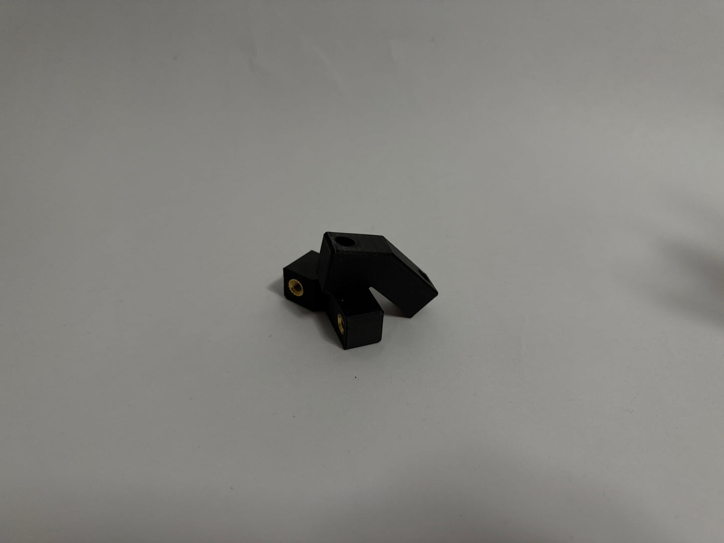 two ModuBlocks laying down on white background