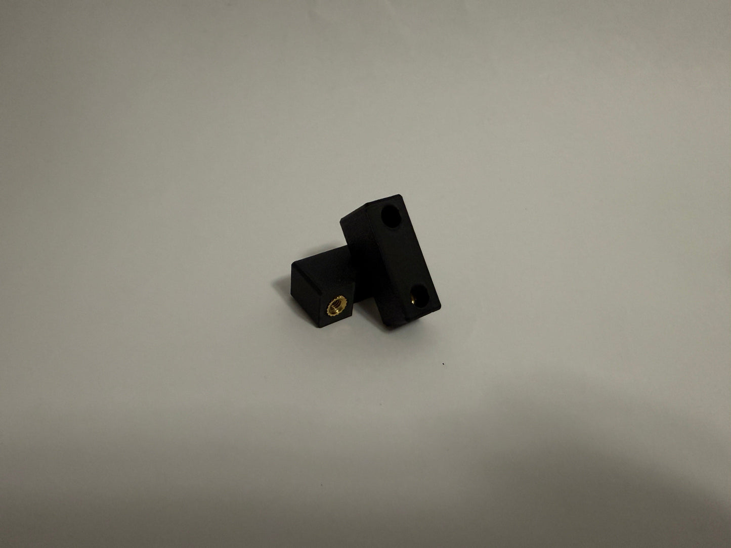two ModuBlocks laying down on white background