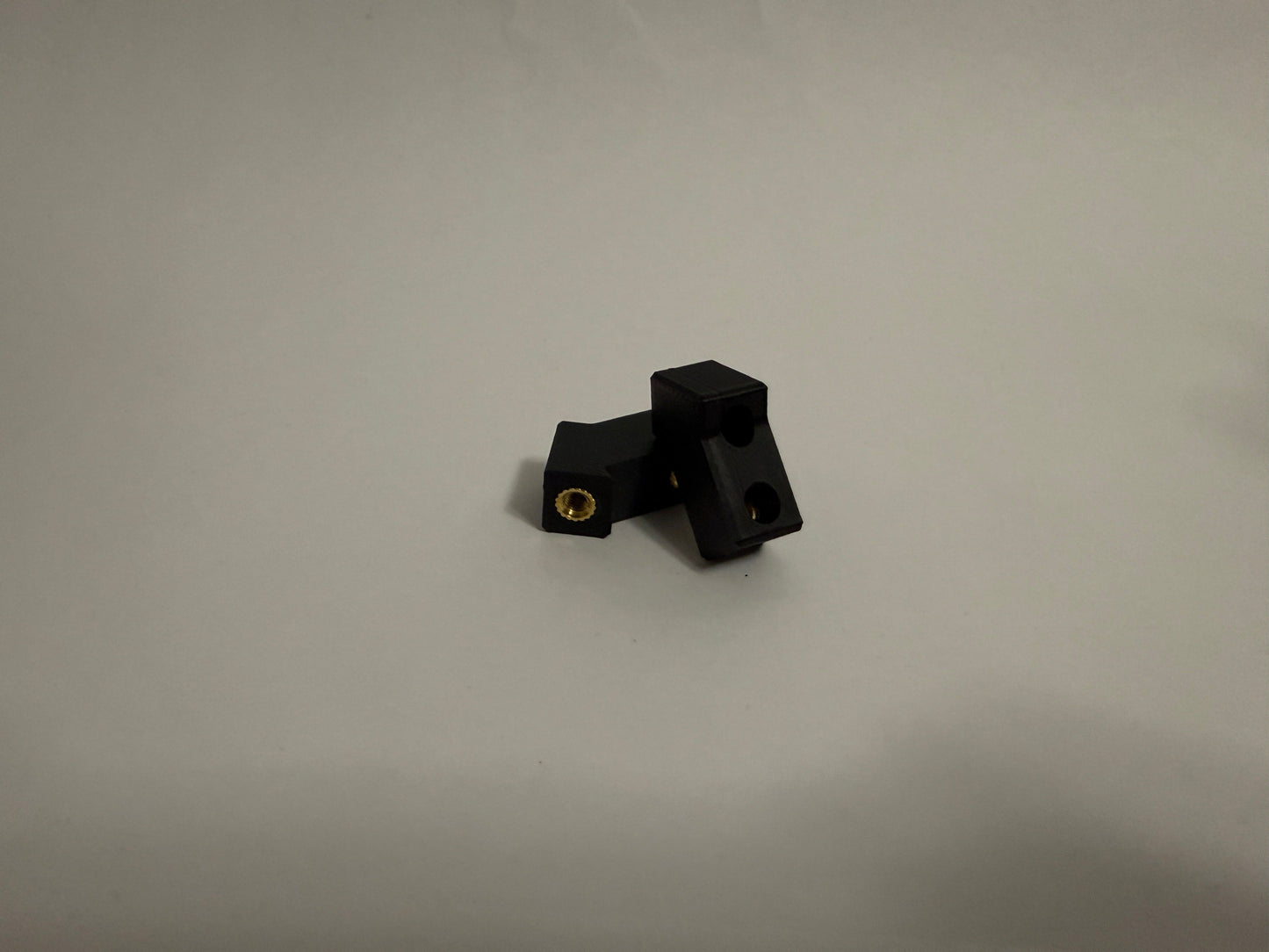two ModuBlocks laying down on white background