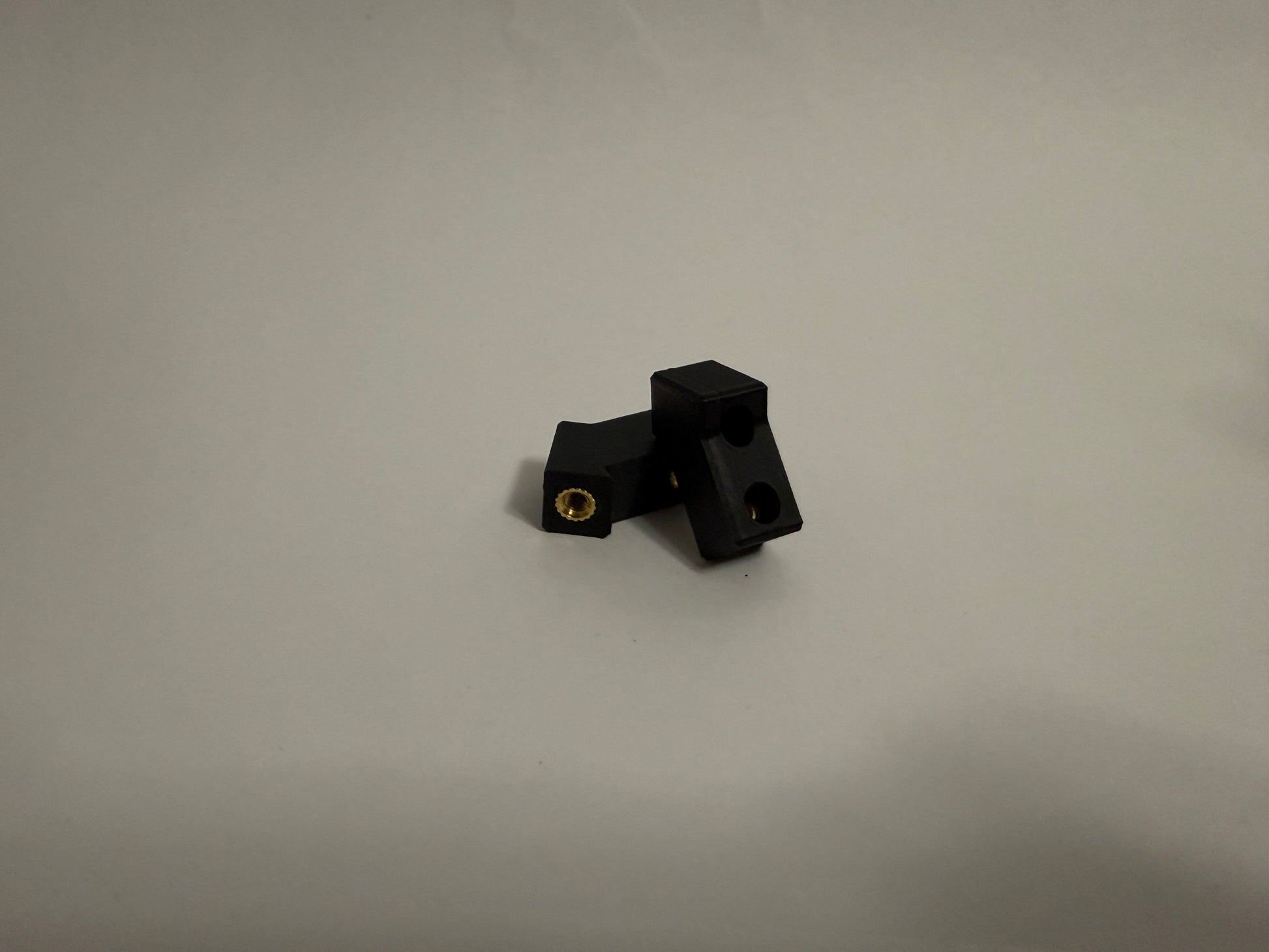 two ModuBlocks laying down on white background