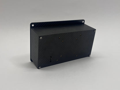 back of carbon fiber button box showing VESA mounts and USB input on grey background