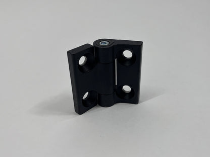 Black metal hinge on a gray background