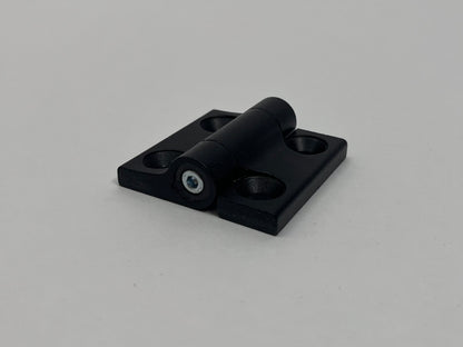 Black metal hinge on a gray background