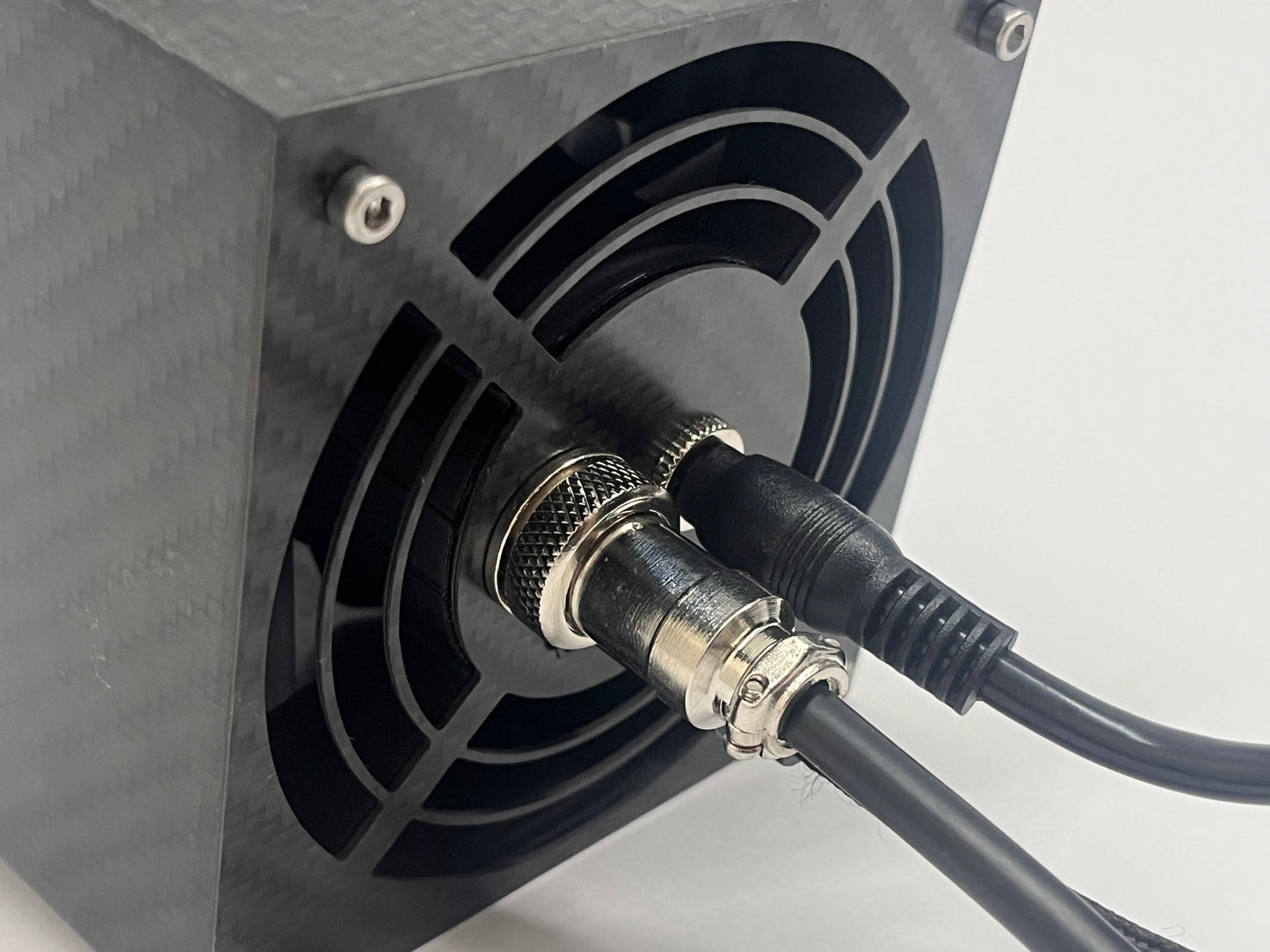 Close up of back of sim racing wind sim showing cables