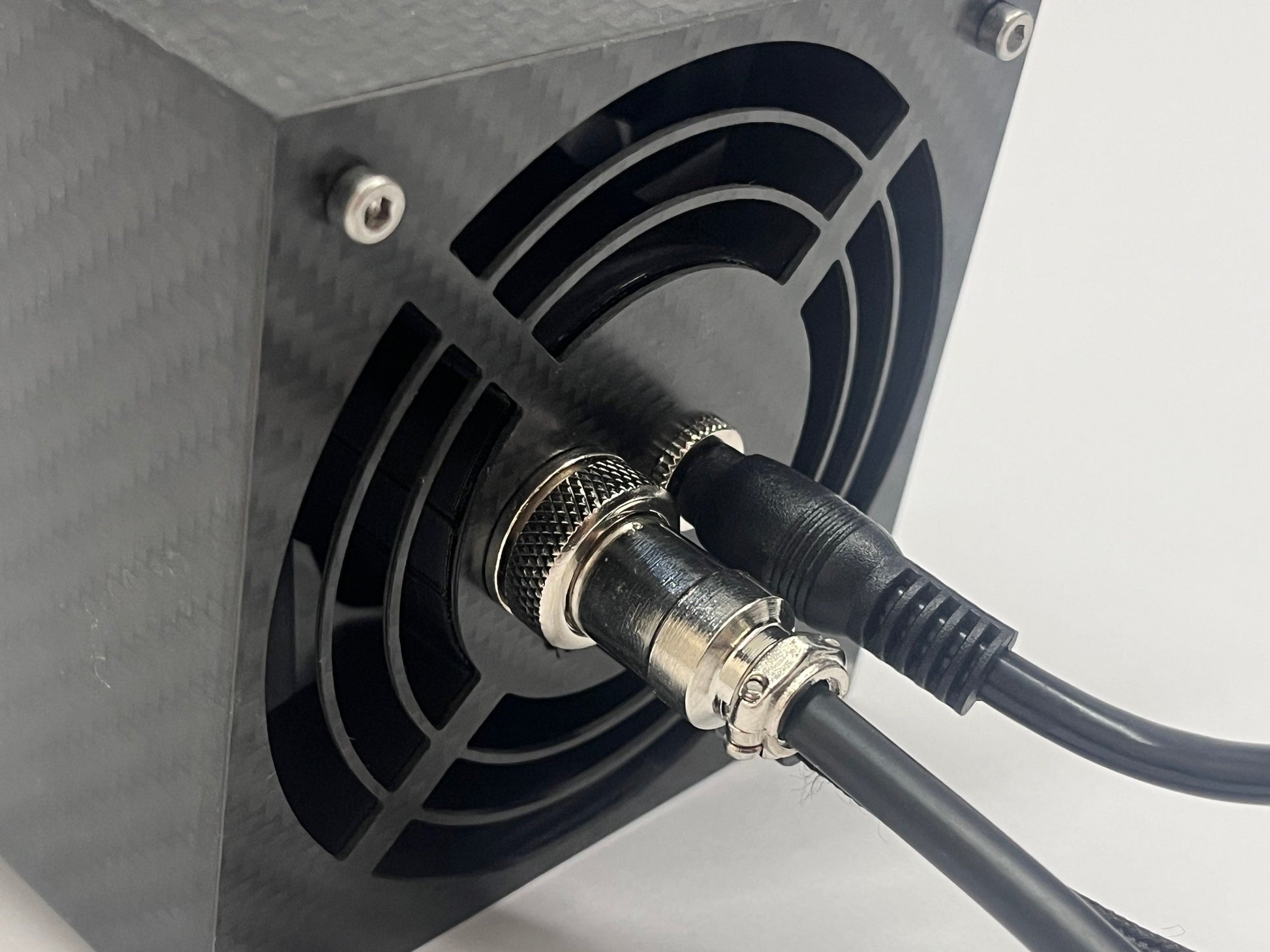 Close up of back of sim racing wind sim showing cables