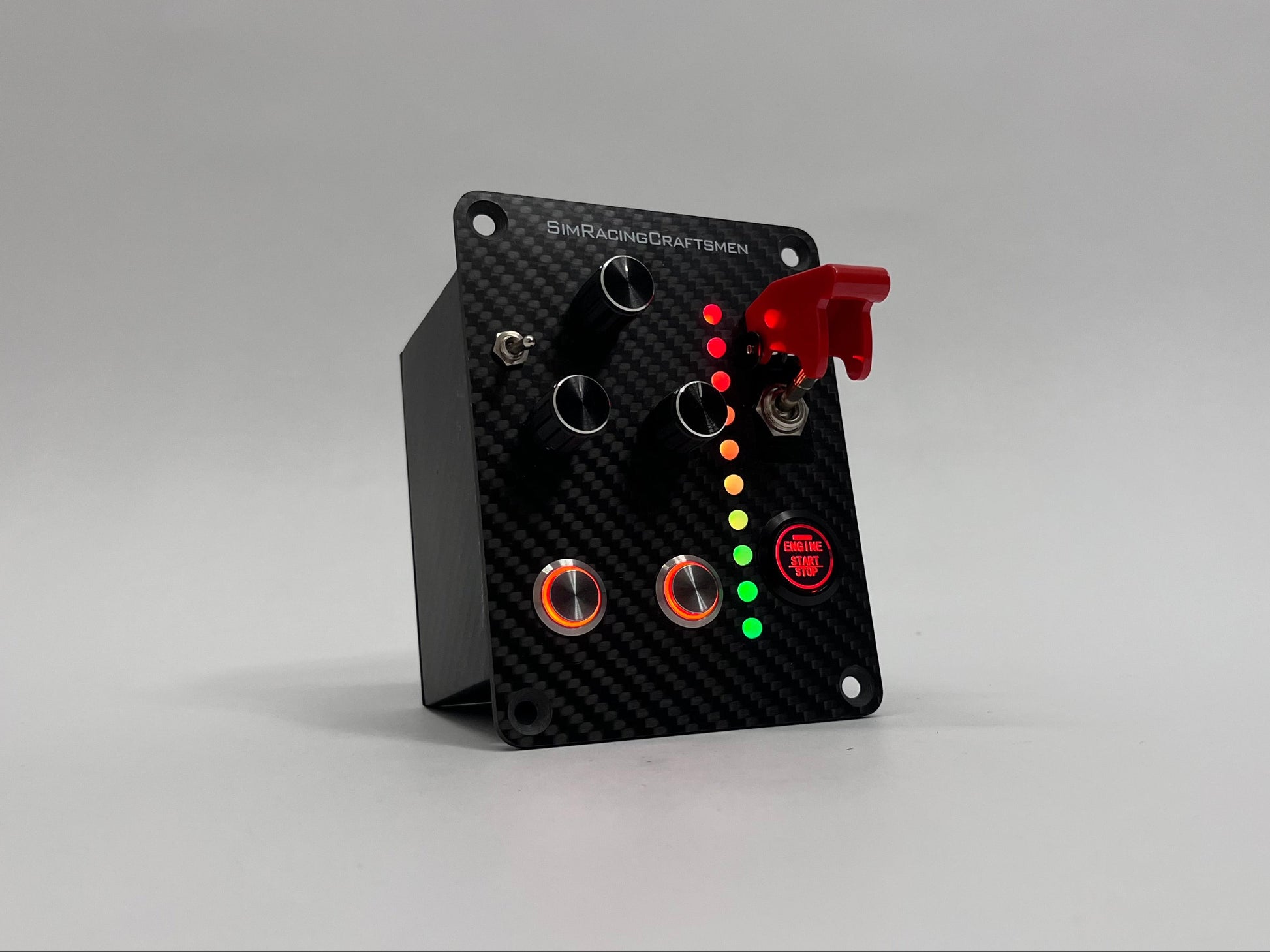 Carbon Fiber button box with red button and LED lights on a gray background