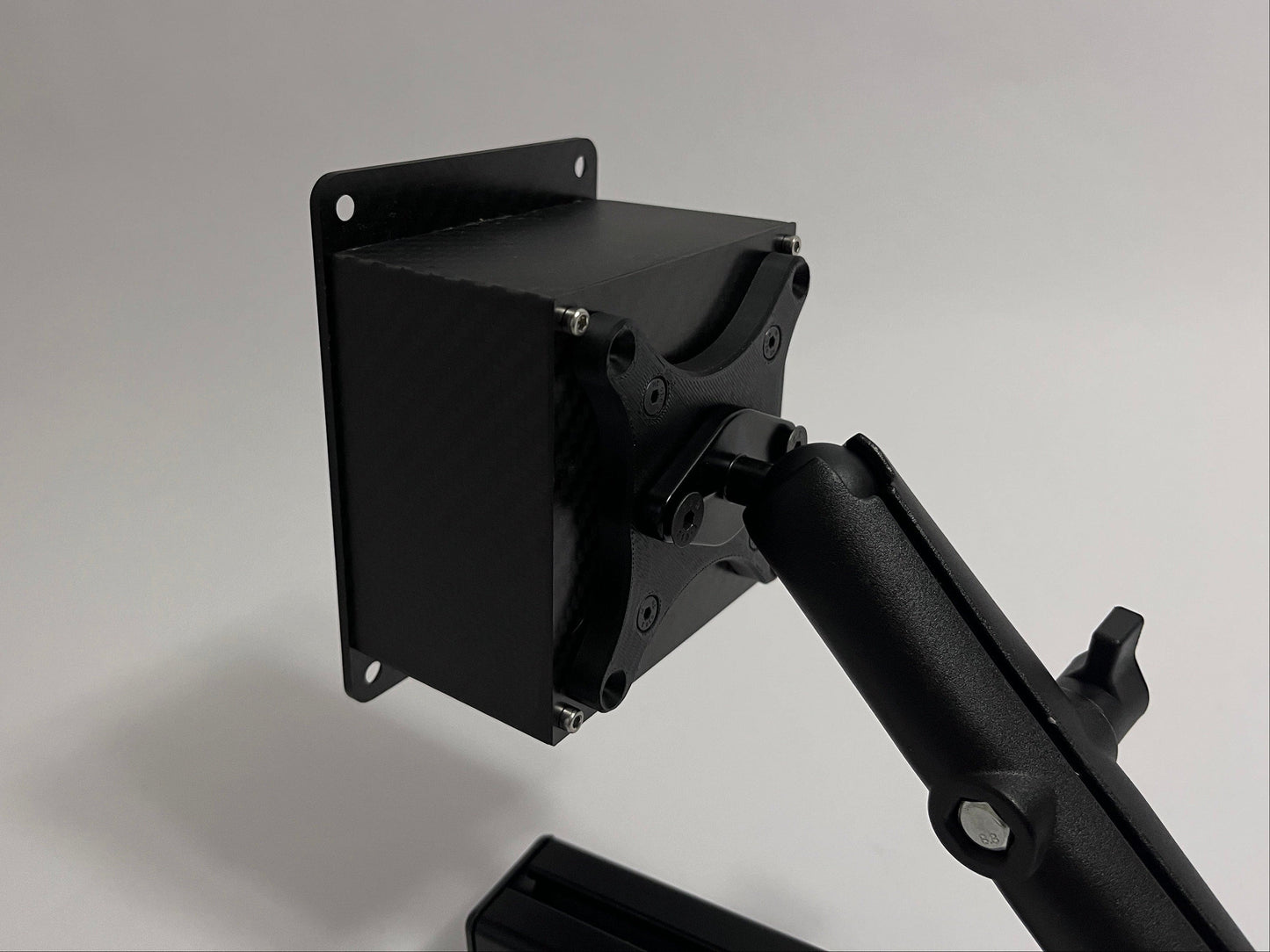 mount with vesa adapter attached to button box on white background