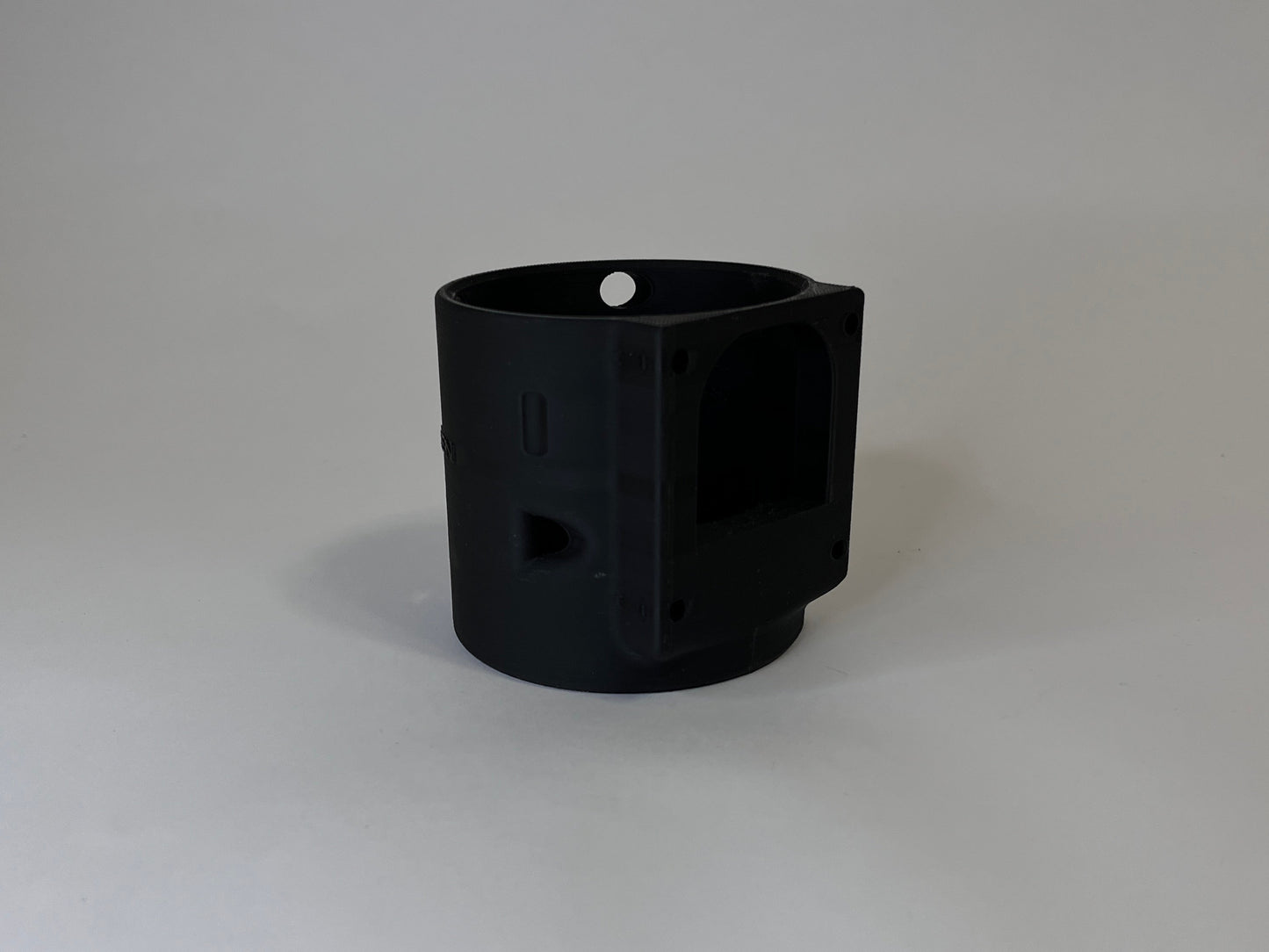 Rear of black CanDock on white background