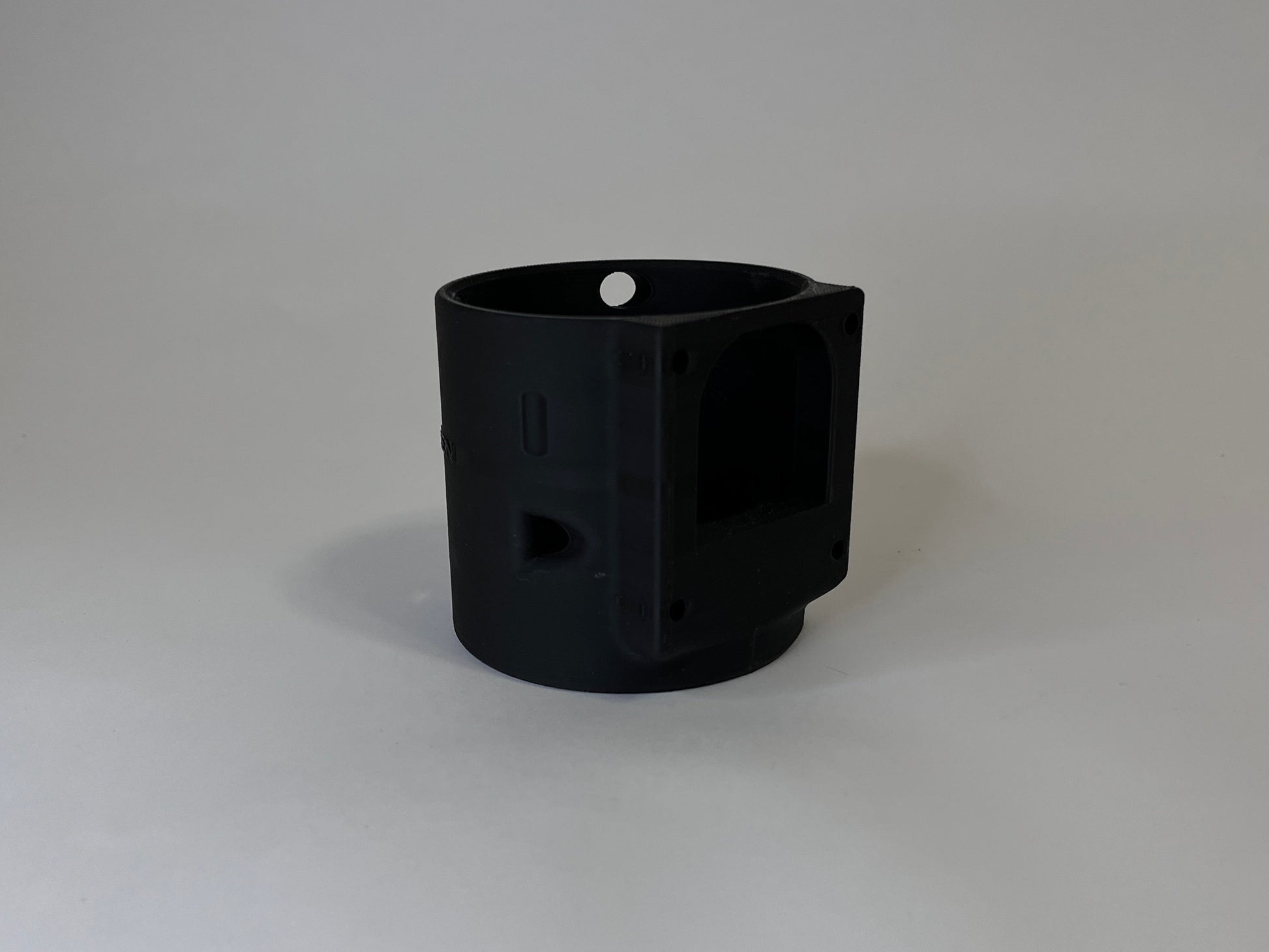 Rear of black CanDock on white background