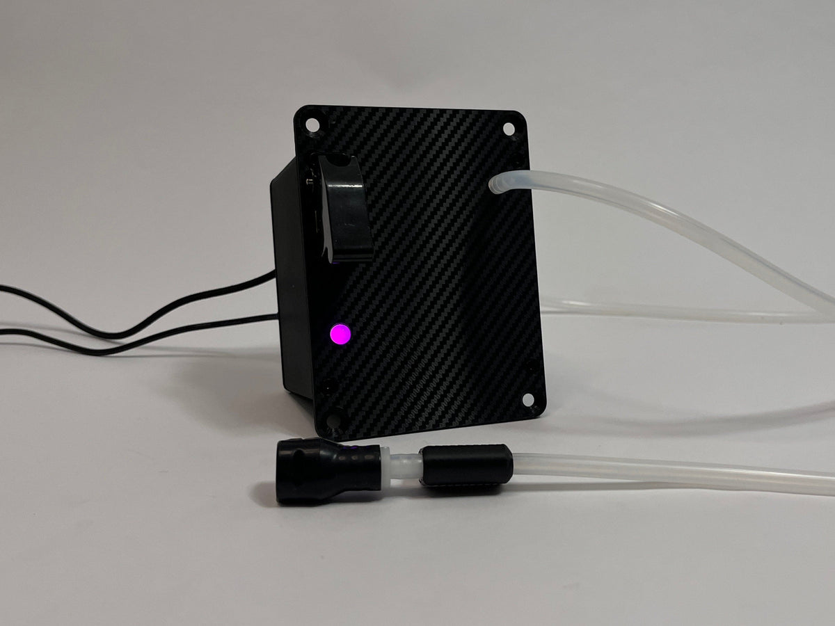 Sim Racing Hydration Device with carbon fiber front texture and purple LED burning. Silicone tubing and cables coming out on a light gray background