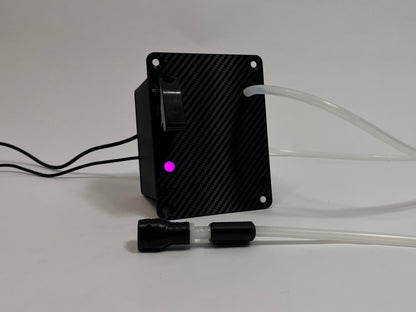 Sim Racing Hydration Device with carbon fiber front texture and purple LED burning. Silicone tubing and cables coming out on a light gray background