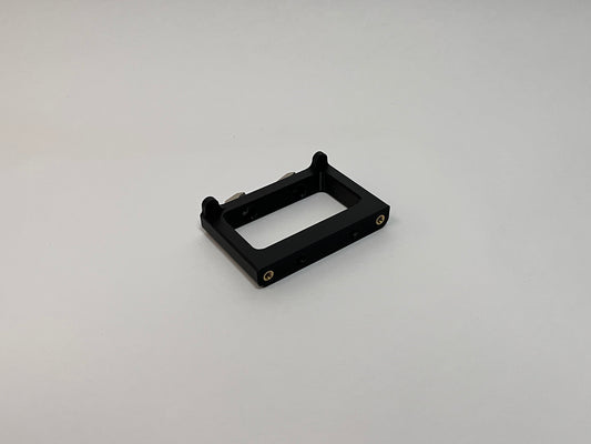 front side view of the button box solid mount showing 4040 profile mounting hardware installed on the mount on a white background