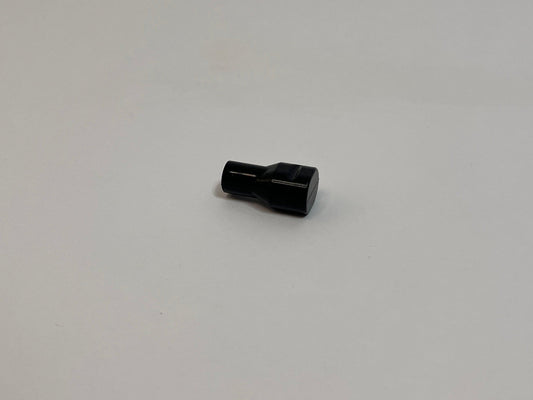 Black Silicone Bite valve sitting on a white background