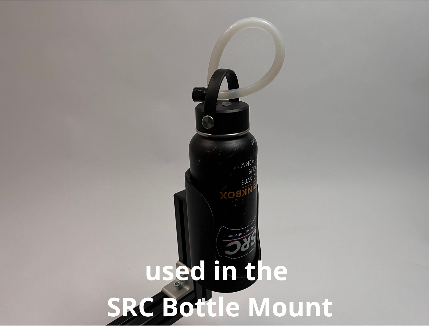 A black bottle with a white looped tube and a black bottle holder mount, shown against a neutral gray background with white text overlay reading 'used in the SRC Bottle Mount'.