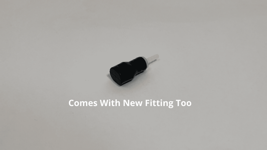 Black Silicone Bite valve with white plastic fitting for tubing in it on a white background