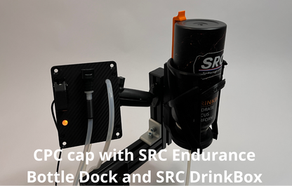 A SRC Endurance Bottle Dock with included bottle in it and SRC DrinkBox connected to tubing, shown against a plain light gray background with white text overlay at the bottom saying "CPC cap with SRC Endurance Bottle Dock and SRC DrinkBox".