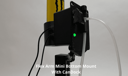 A black Flex Arm Mini Bottom Mount with CanDock mounted on sim racing drink unit, shown holding a yellow Monster Energy can and a clear tube, on a light gray background with white text overlay.