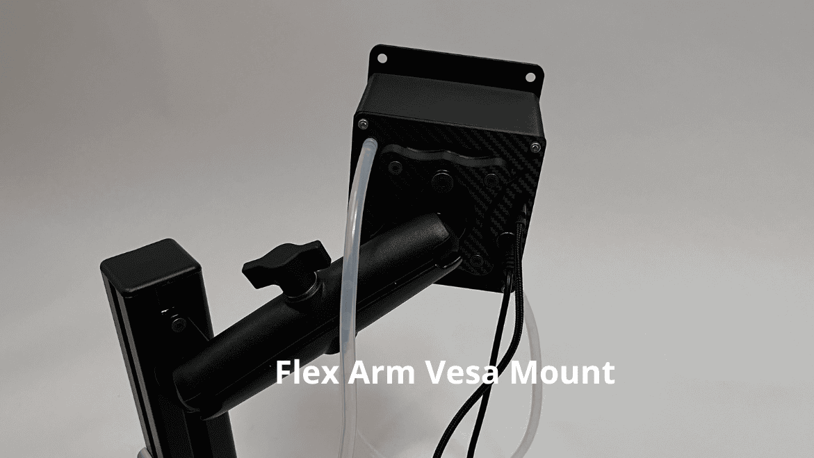 Black flex arm vesa mount hardware with a carbon fiber textured plate, black metal arm attached to a sim racing hydration system drinkbox, and white tubing and black cables, shown on a light gray background with a text overlay reading 'Flex Arm Vesa Mount'.