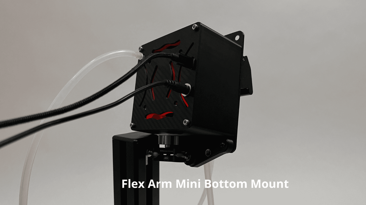 rear of drinkbox racing hydration system showing orange internal cooling  ducts and rear black carbon fiber textured plate, shown against a light gray background with a text overlay reading 'Flex Arm Mini Bottom Mount'.