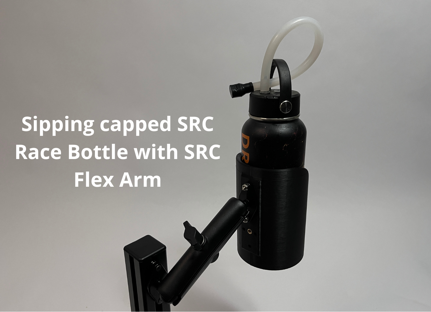 A black sipping-capped race bottle with a curved white straw and a black flex arm mount, shown against a light gray background with white text reading 'Sipping capped SRC Race Bottle with SRC Flex Arm'.